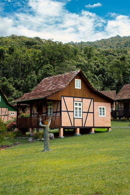 Free Rustic alpine-style cabin amidst lush greenery in Santa Catarina, Brazil. Stock Photo