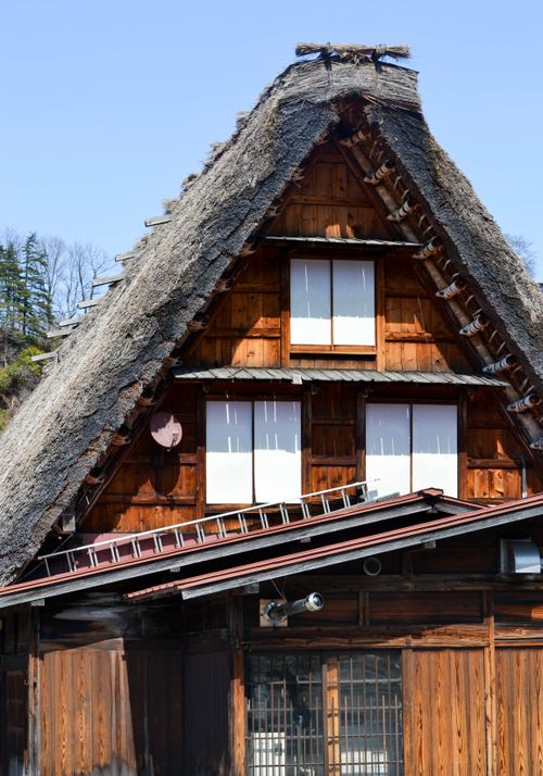 Free Gassho-Zukuri style house with thatched roof in Shirakawa-go, Japan, showcasing traditional Japanese architecture. Stock Photo
