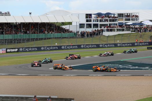 Fans watching the race from the grandstand during the Spanish Grand Prix travel costs season.