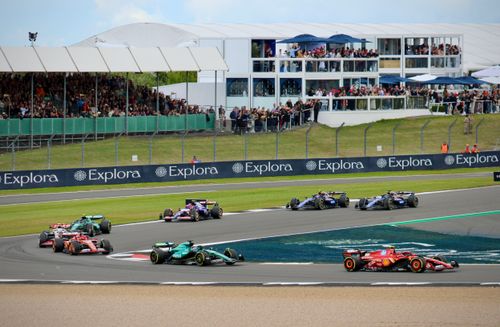 Free High-speed Formula 1 race at Silverstone Circuit, England, with enthusiastic spectators. Stock Photo