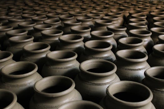 An image showcasing handcrafted clay pots arranged in a striking repetitive pattern.