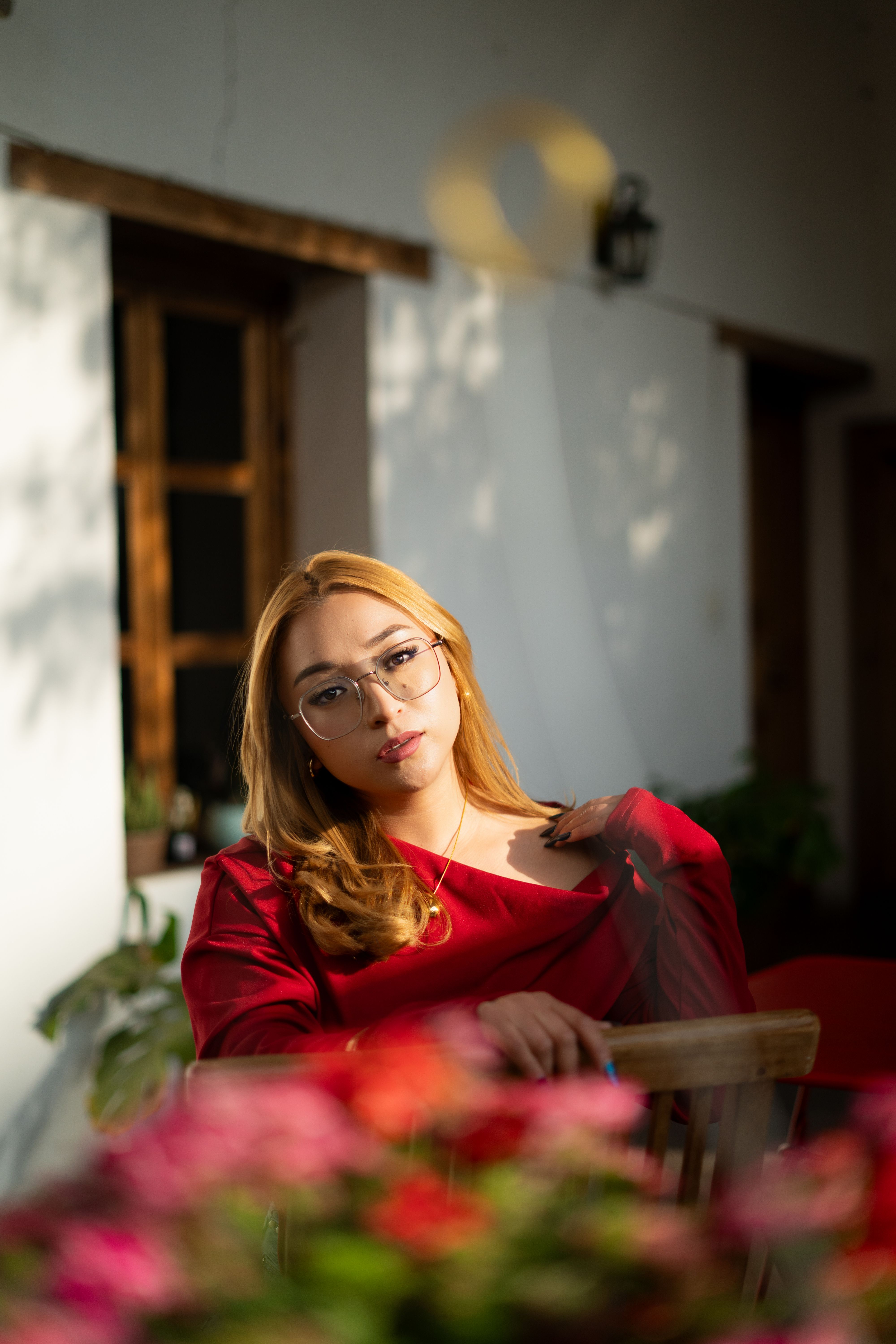 Elegant Woman in Red Dress Relaxing Indoors · Free Stock Photo
