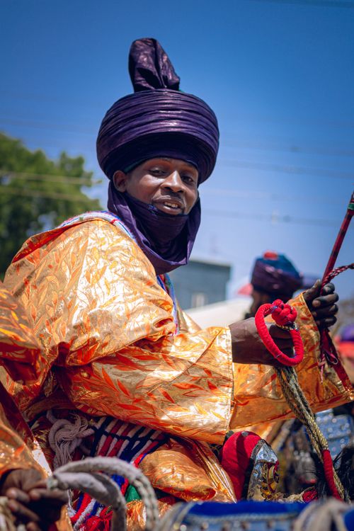 Free Vibrant portrait of an African man in traditional attire at a cultural celebration outdoors. Stock Photo