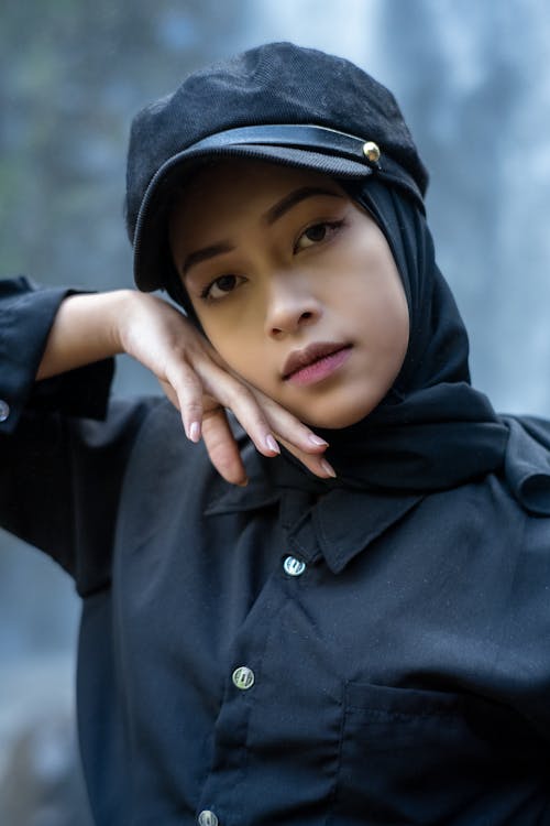 Woman in Black Top and Black Hat