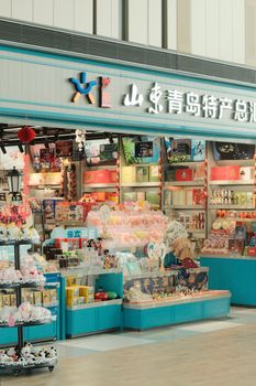 Vibrant merchandise shop in Qingdao, China showcasing a variety of local products and souvenirs.