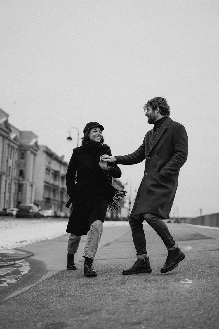 Monochrome Photo Of Couple Walking On Street