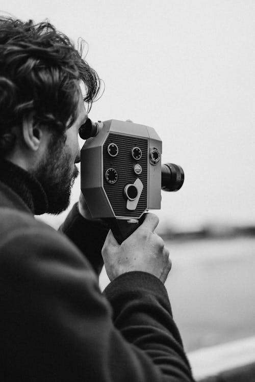 Man in Long Sleeve Capturing Photo