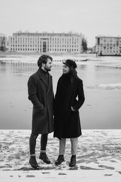 Monochrome Photo of Couple Standing Next To Each Other