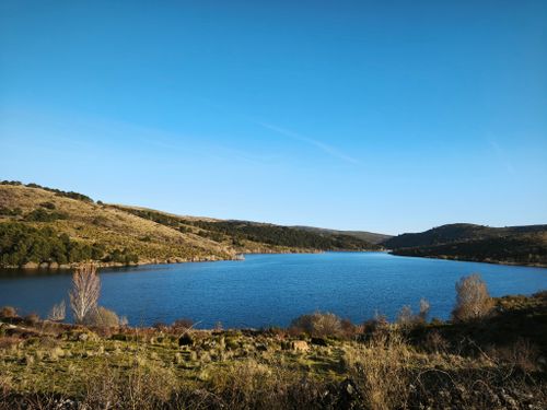 Free Beautiful lakeside scenery in Peguerinos, Castilla y León, Spain with clear blue sky. Stock Photo