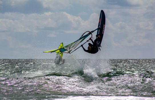 Exciting windsurfing action captured off the coast of Portugal, showcasing skill and energy.