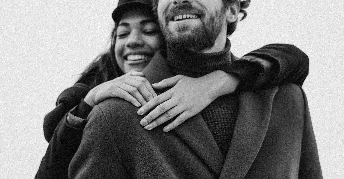 Hugging Coat Woman Hugging Man Wearing Black Coat · Free Stock Photo