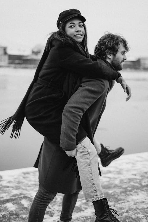 Man Carrying Woman While Walking · Free Stock Photo
