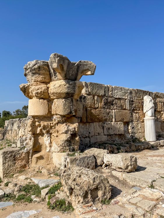 Ancient Stone Ruins with Statue under Clear Sky · Free Stock Photo