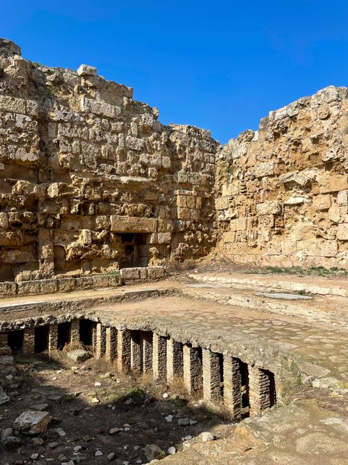 Free Explore the ancient stone ruins bathed in sunlight, showcasing historical architecture. Stock Photo