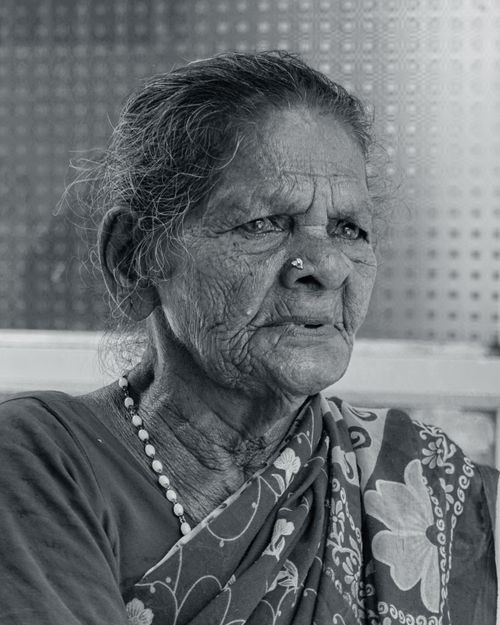 Free Black and white portrait of an elderly woman in traditional clothing, exuding wisdom and grace. Stock Photo