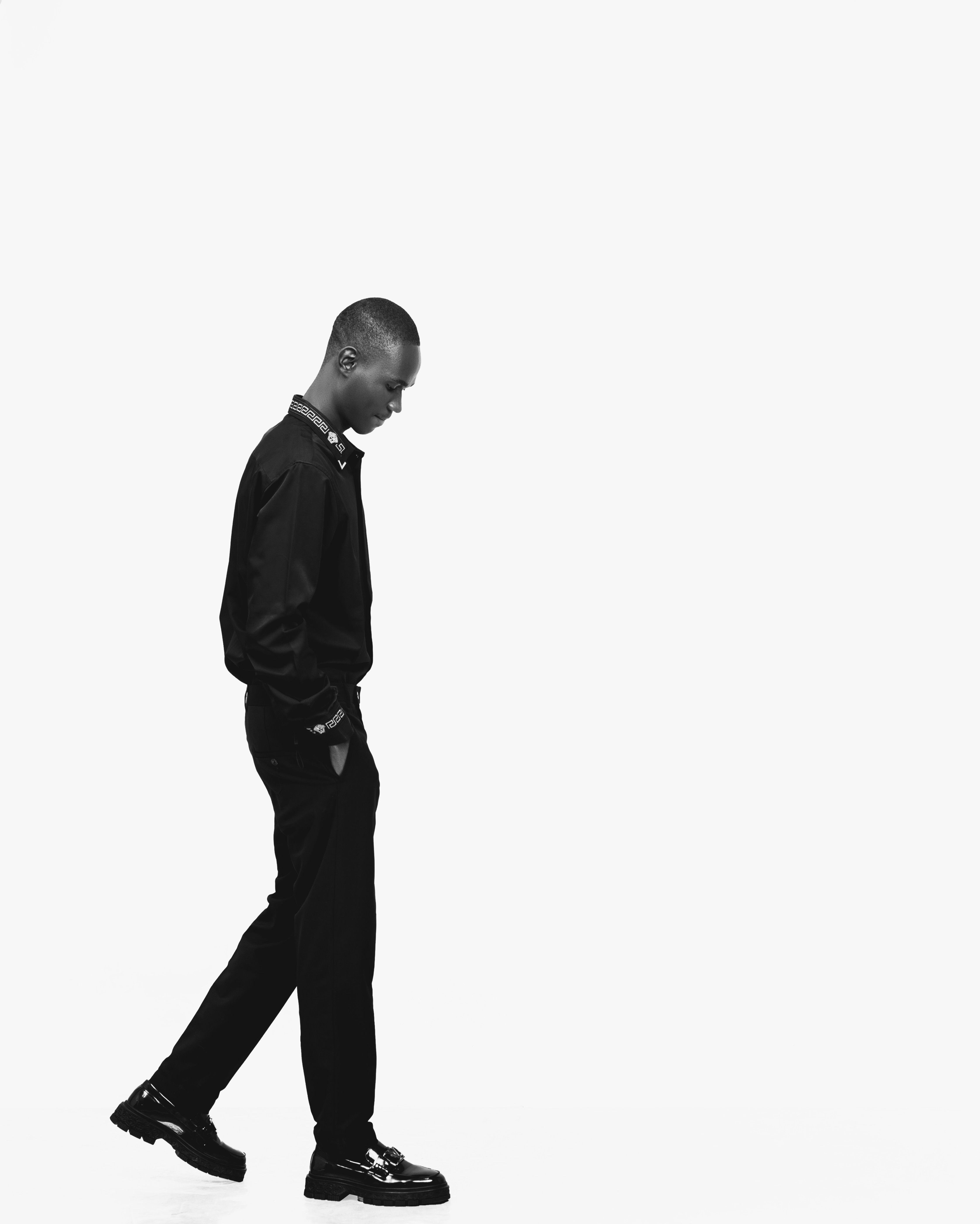 Black and White Portrait of a Man Walking · Free Stock Photo