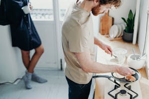 Man Wearing Beige Shirt While Cooking