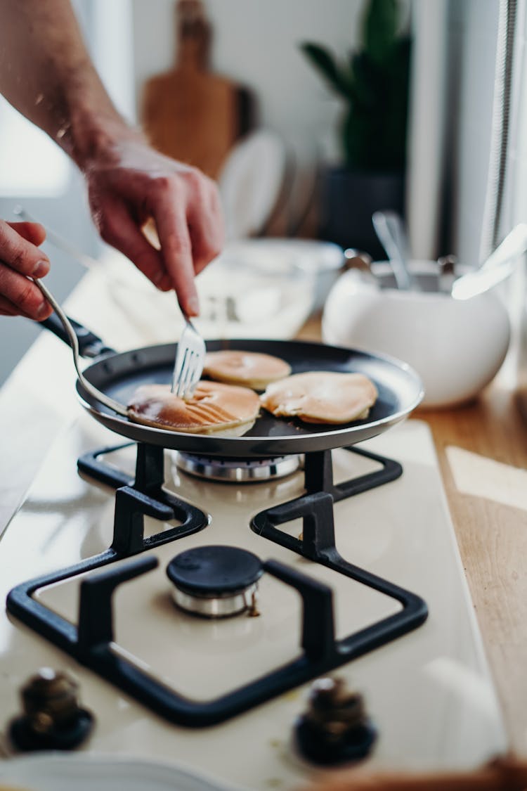 Person Cooking Pancakes