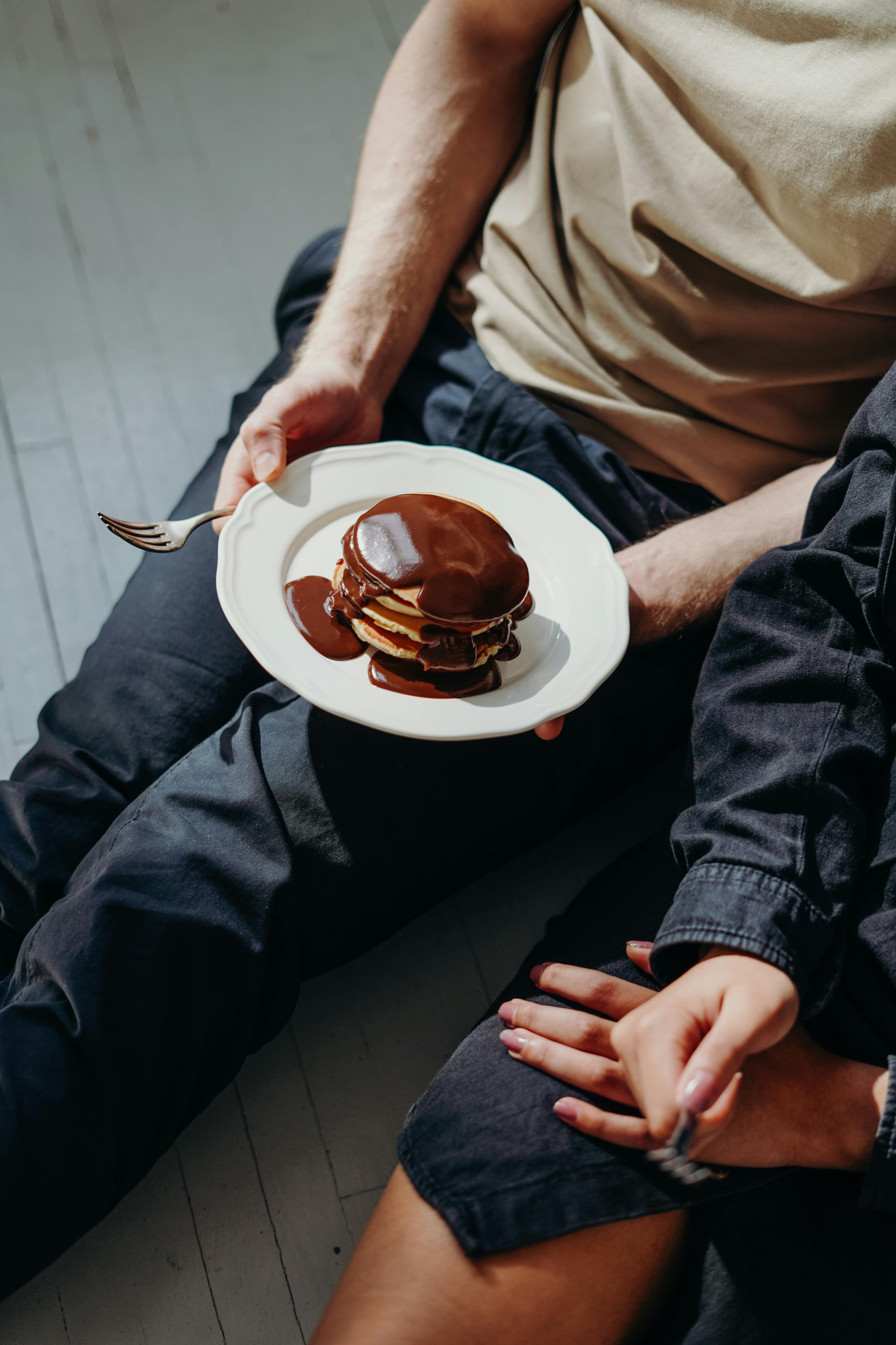 Person Holding Plate With Chocolate Pancakes · Free Stock Photo