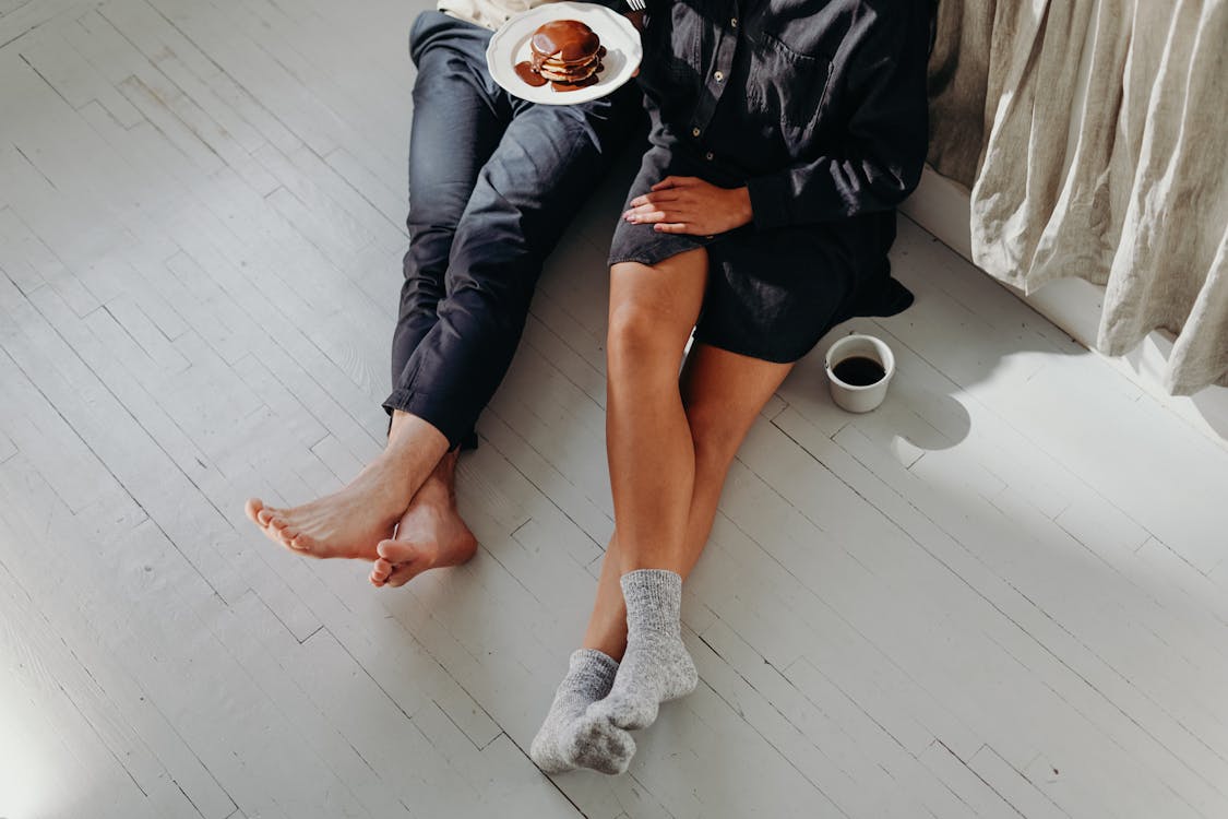 Free A Couple Having Breakfast On The Floor Stock Photo