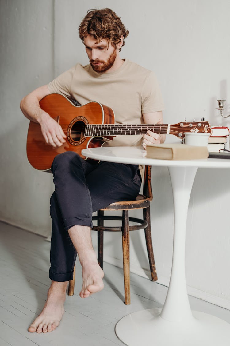 Man Playing Acoustic Guitar