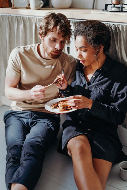 Free Photo of Couple Eating Pancakes Stock Photo