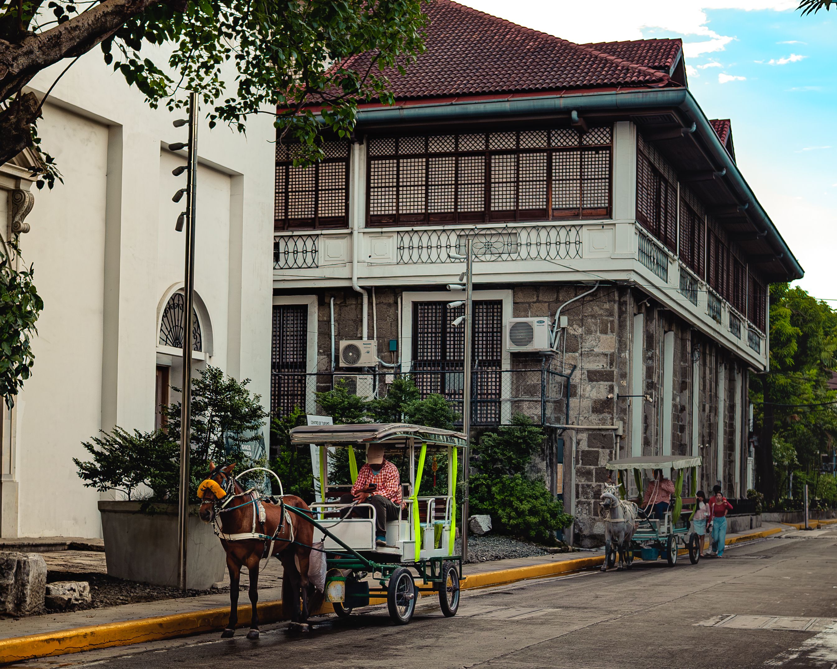 A traditional Kalesa horse-drawn carriage offering tours within the historic walls of Intramuros, Manila, Philippines