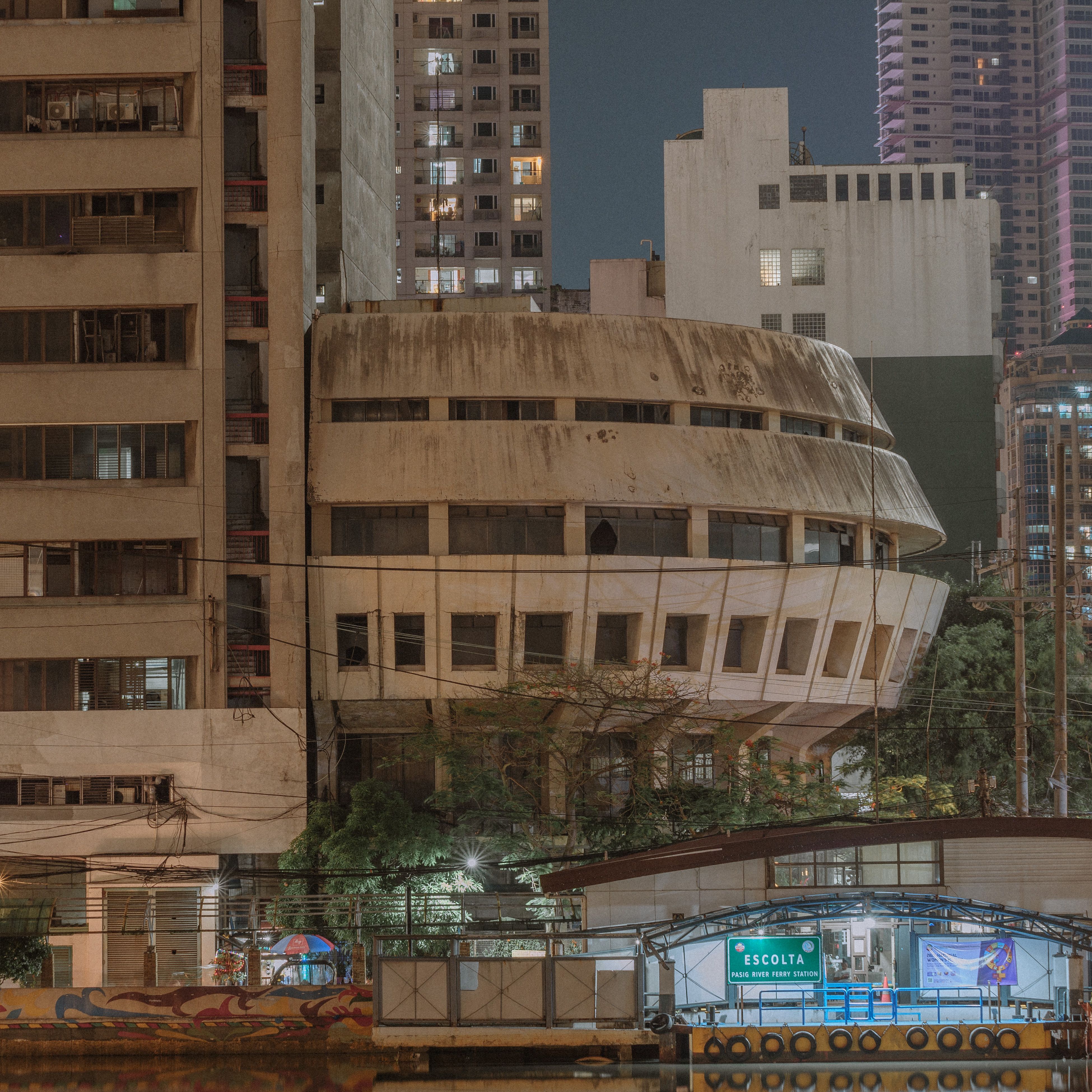 Night view of the Escolta area in Manila, showcasing modern architecture and urban landscape.