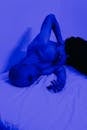 Bald Man Lying on Bed