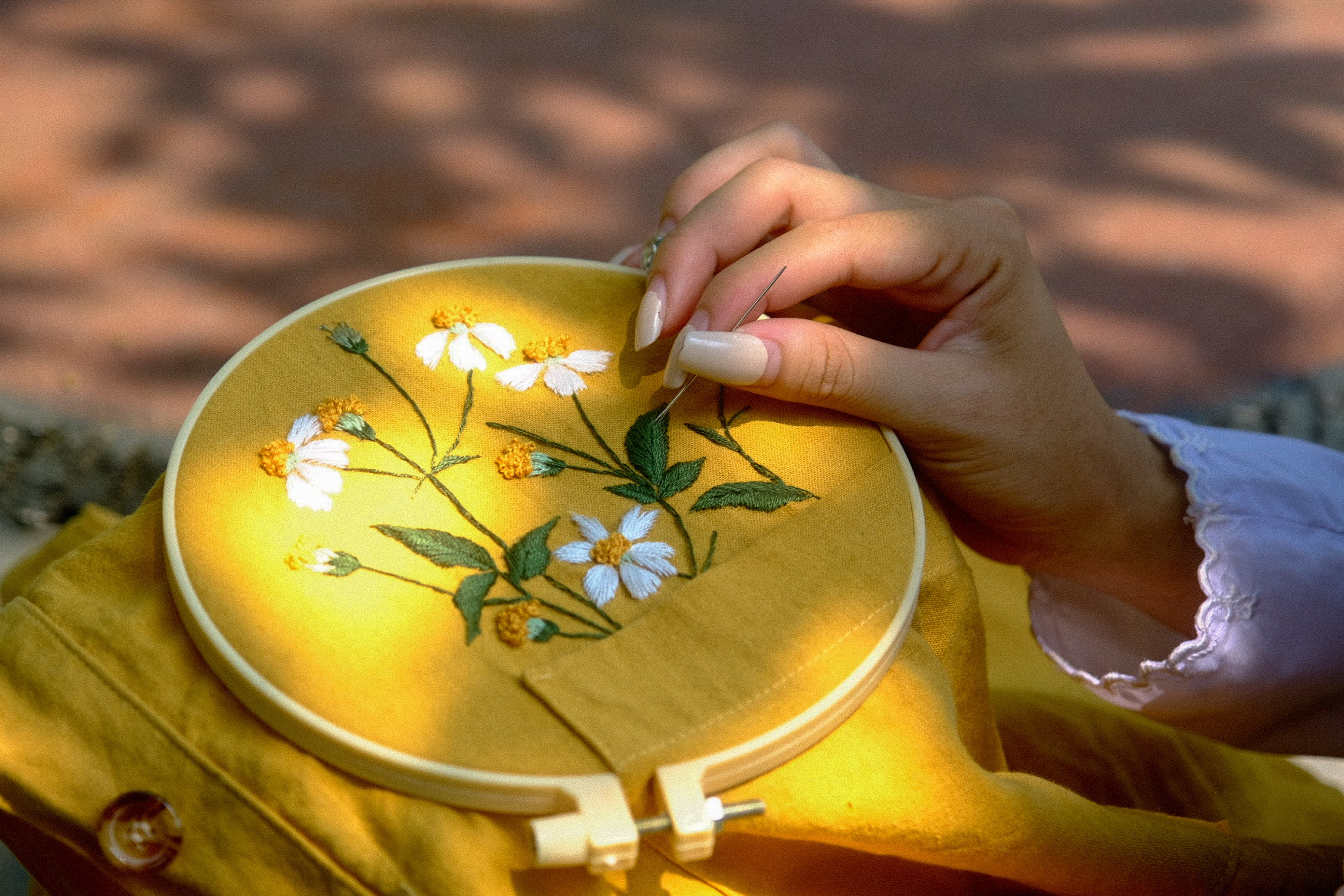 Beautiful hand embroidery of flowers in sunlit Hue, Vietnam.