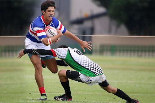 Photo of Men Playing Rugby