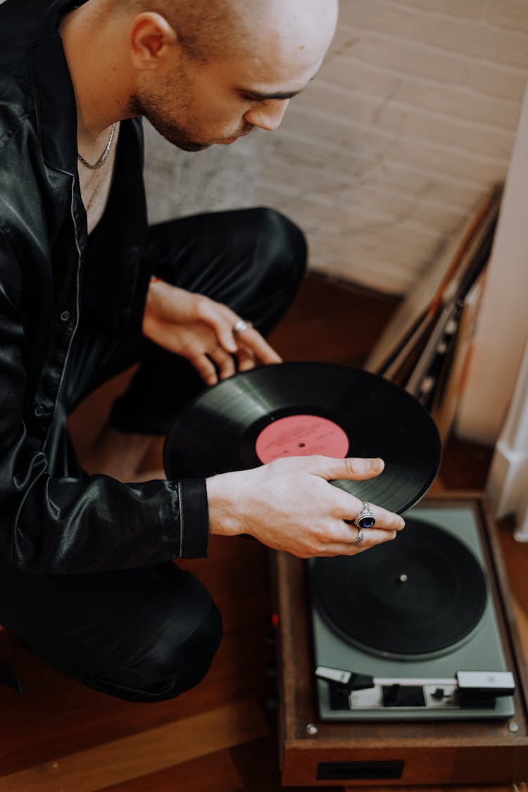 Man Holding Black Vinyl Record