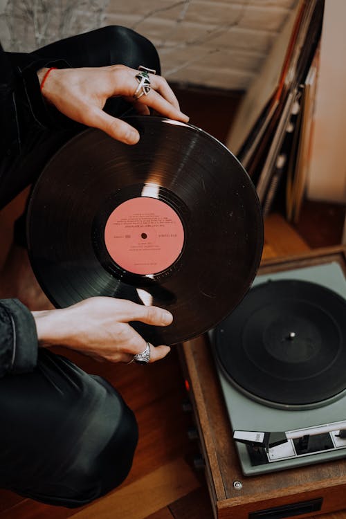 Person Holding Vinyl Record · Free Stock Photo