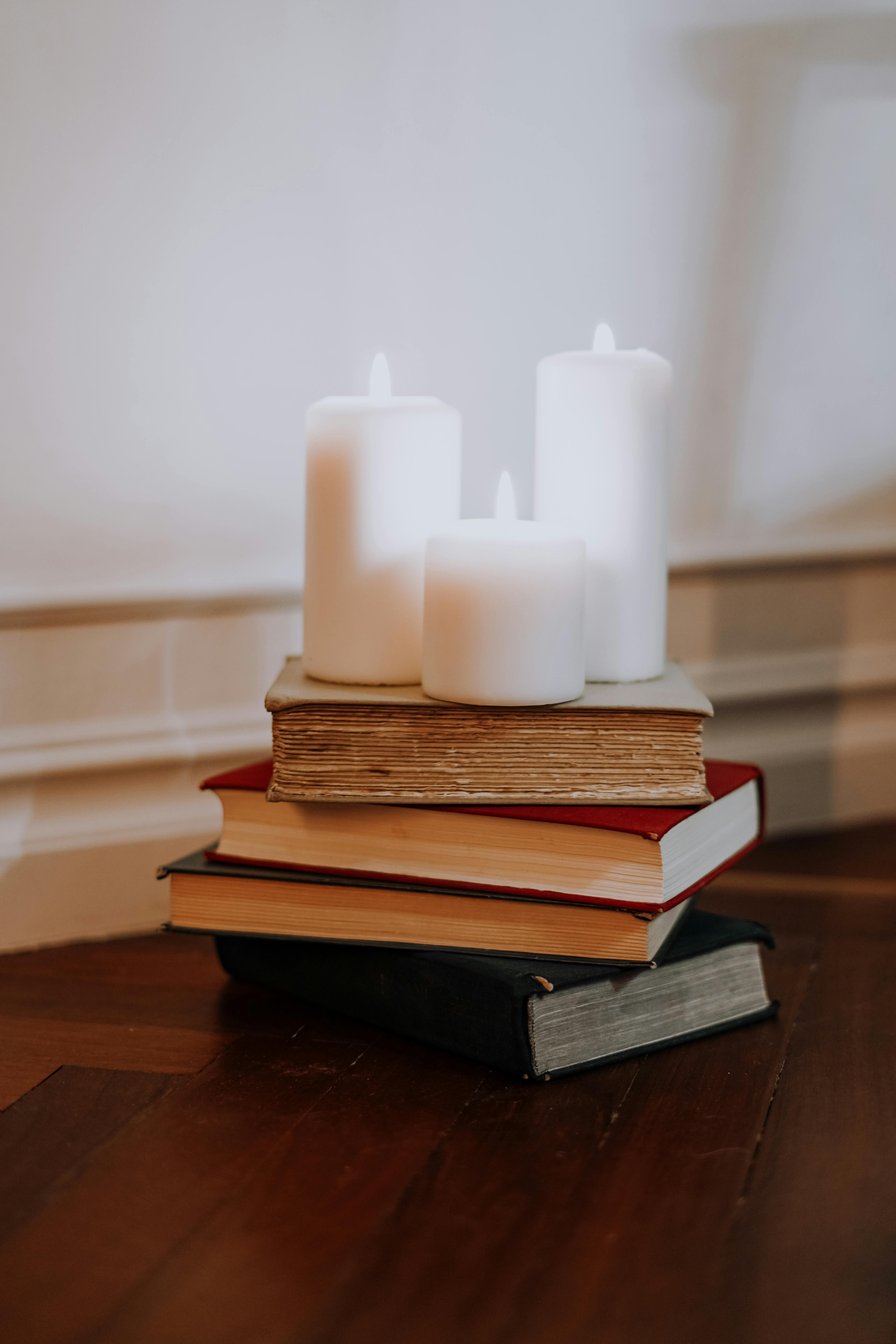 Photo Of Candles On Top Of Books · Free Stock Photo