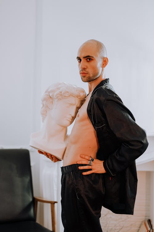 Man Holding Gypsum Head