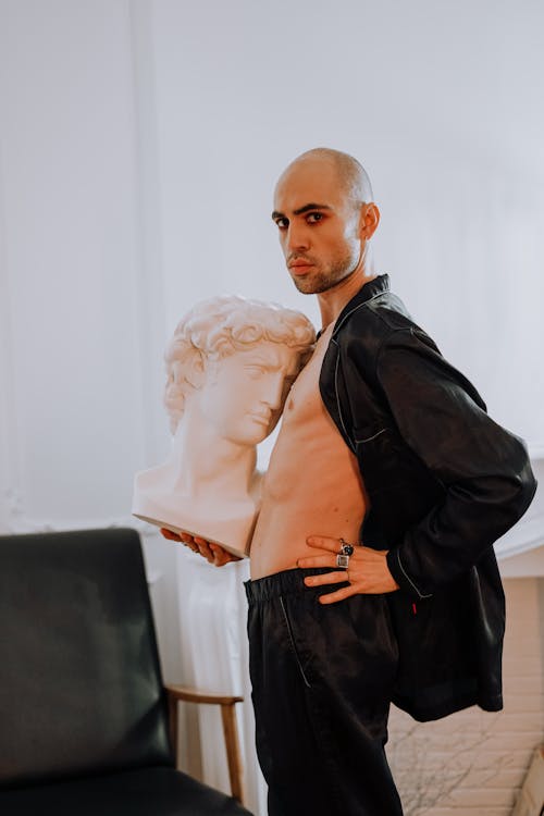 Man Holding a Gypsum Head