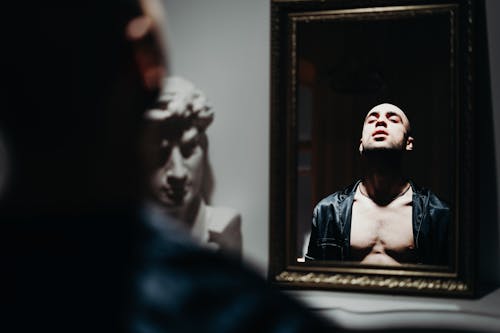Free Man In Front of The Mirror Stock Photo