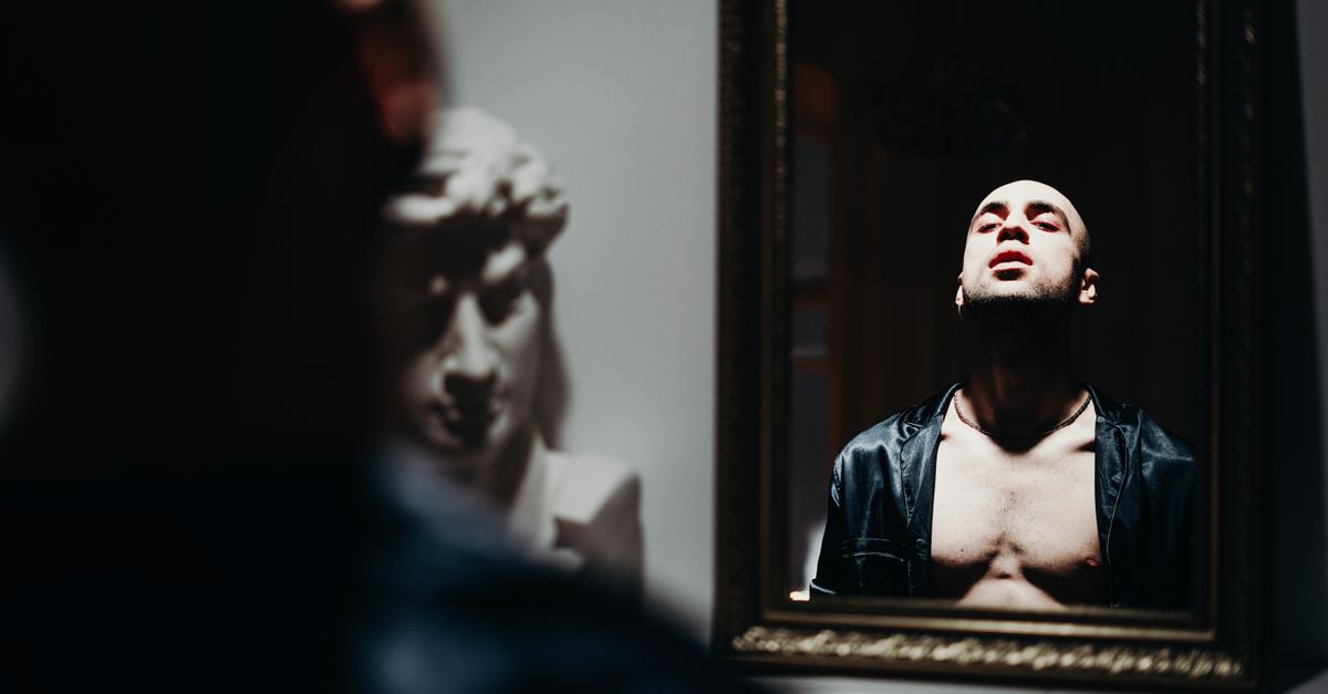 man mirror reflection
