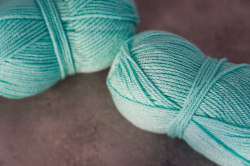 Teal Yarn on Gray Surface