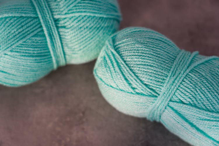 Teal Yarn On Gray Surface