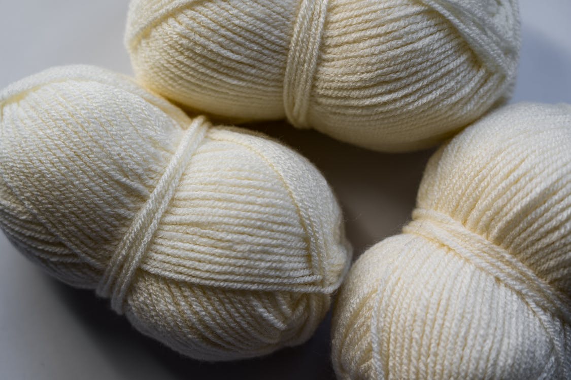 Close-Up Photo of White Yarn