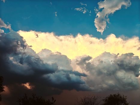 A stunning display of contrasting clouds during sunset in Koraon, Uttar Pradesh.