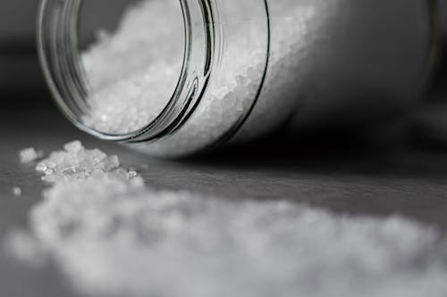 Selective Focus Photo of Salt in Glass Jar