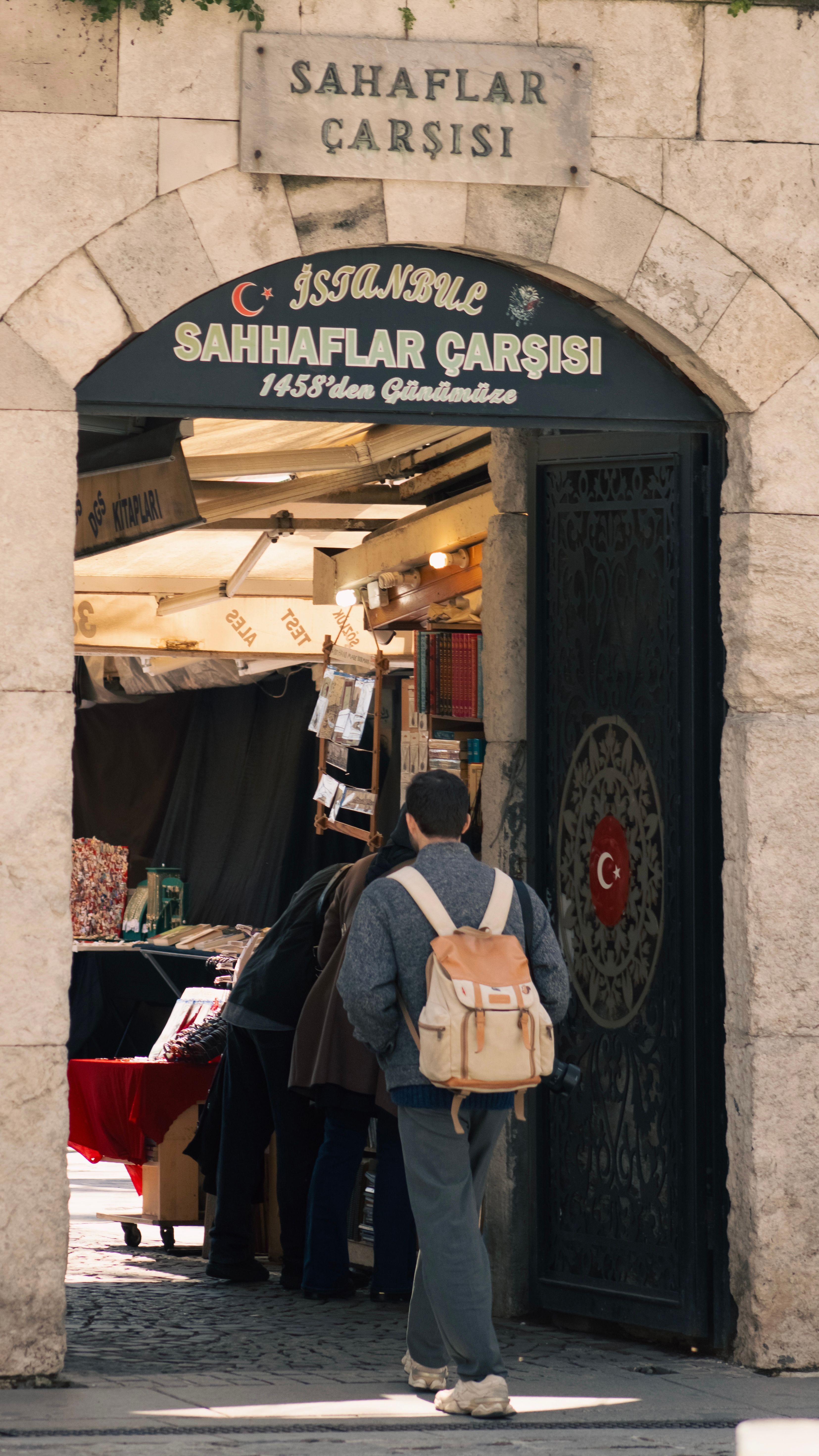 Visitors explore the historic Sahaflar Çarşısı in Istanbul, Turkey.