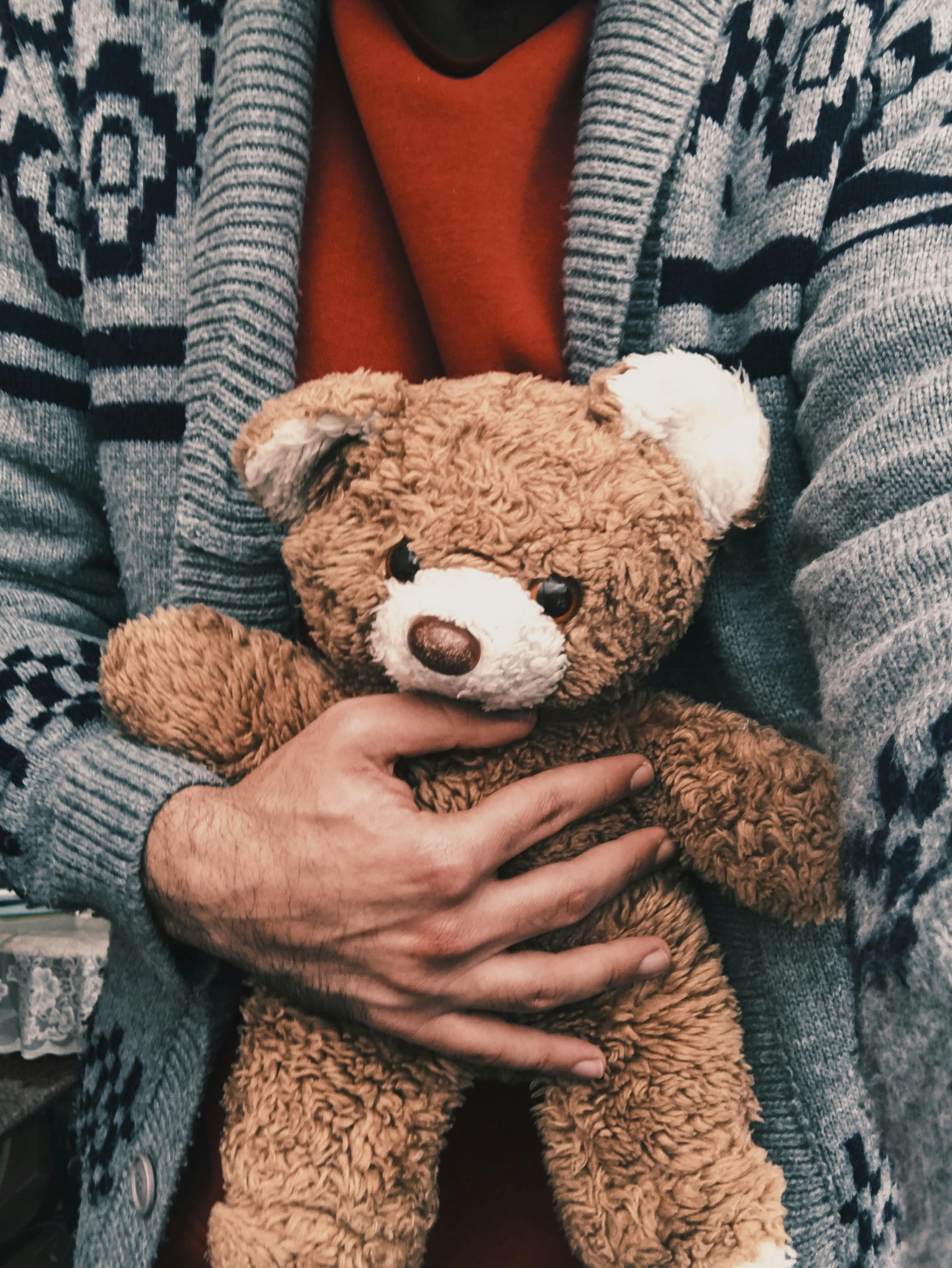 person in bear stuffed animal