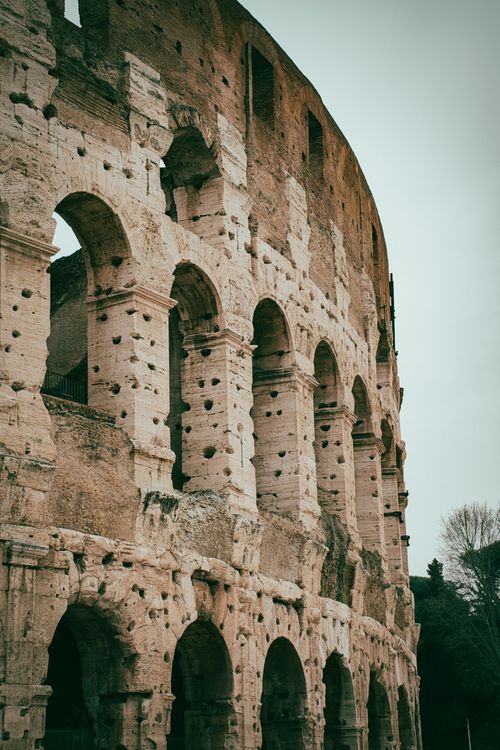 Free A detailed view of the iconic Colosseum arches in Rome, Italy, showcasing ancient Roman architecture. Stock Photo