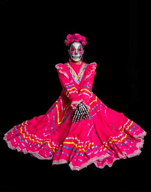 Free Colorful Catrina costume with floral decorations, symbolizing Mexican folklore. Stock Photo