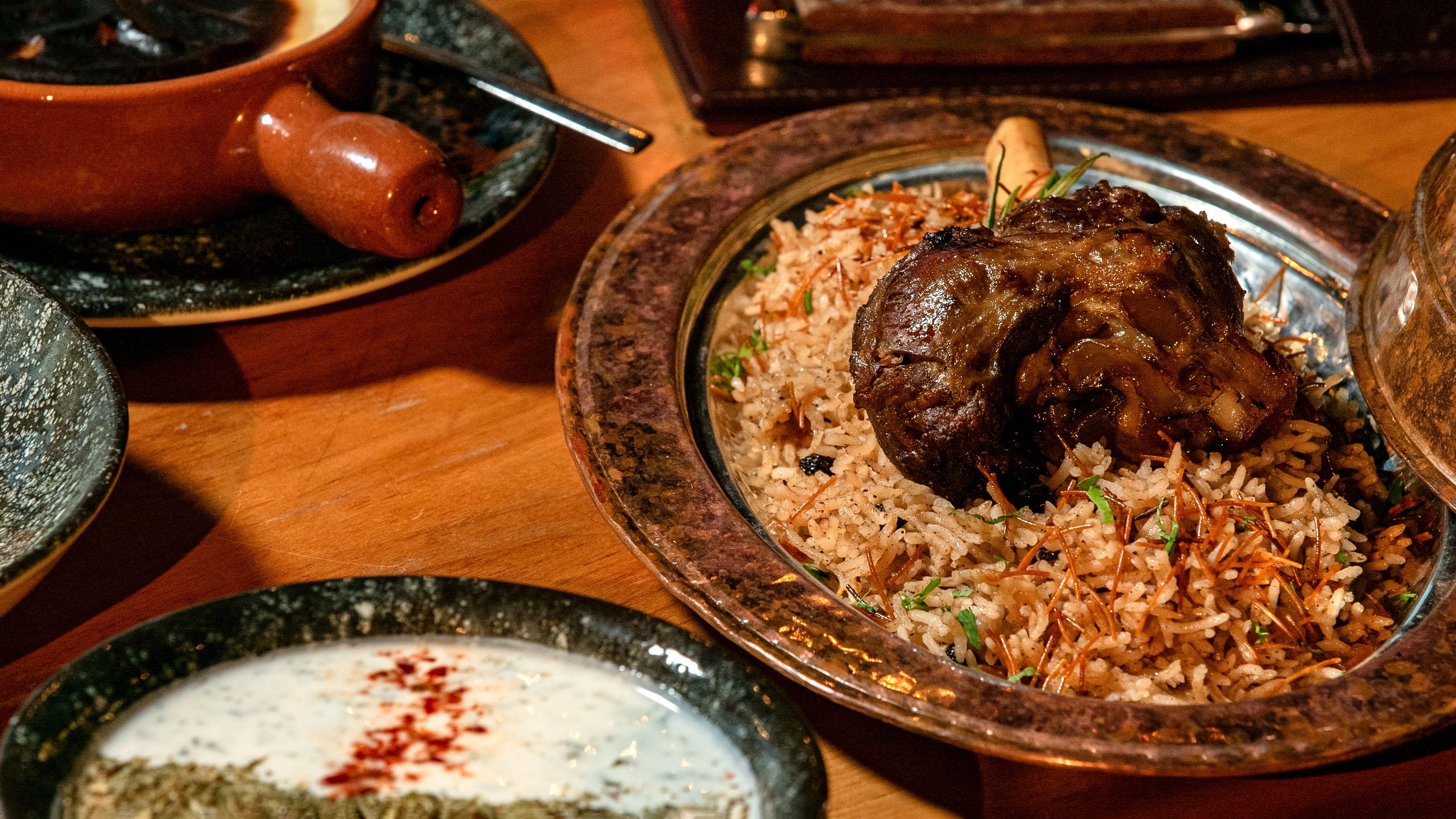 Appetizing lamb biryani served with rice and spices in a traditional setting.