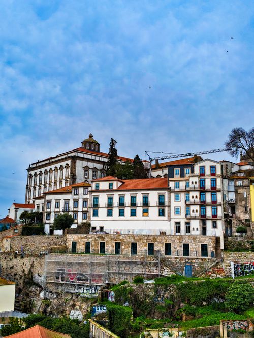 Free Explore the charming traditional architecture of Porto with colorful buildings against a vibrant sky. Stock Photo