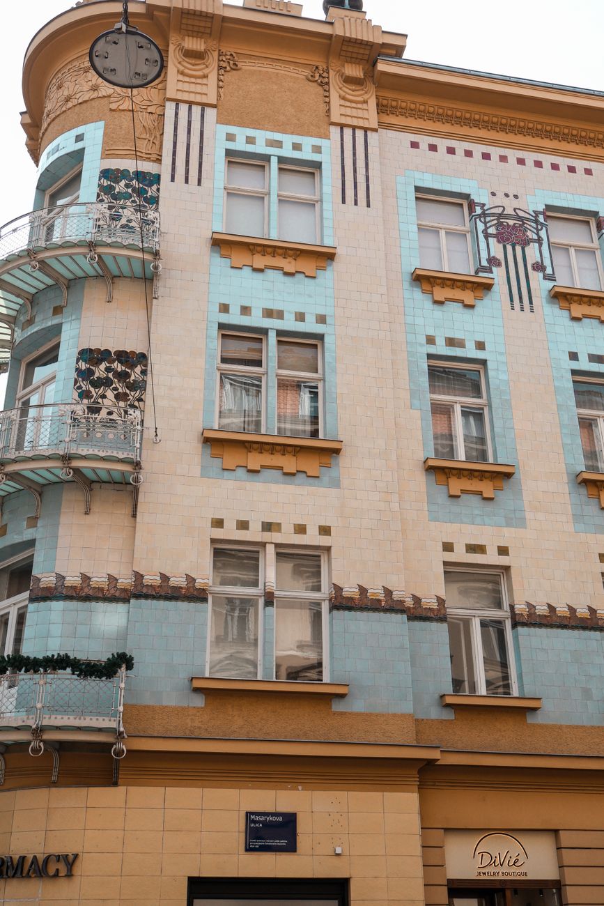 Close-up of an Art Nouveau facade with blue and beige tiles on a city building.. close, nouveau, facade